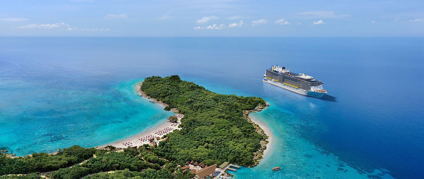 A Royal Caribbean cruise ship sailing around the island of Lelepa.